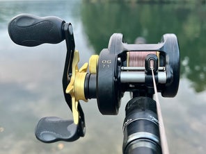 A head-on view of the Bates 100 OG casting reel while mounted to a rod.