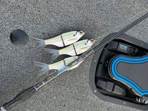 Spro K Rig laying on boat deck attached to Dobyns rod