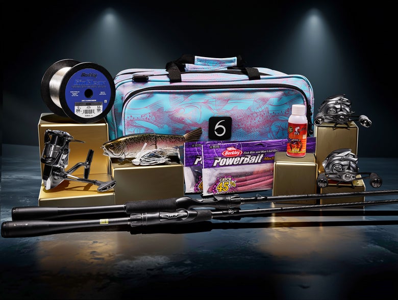 Group shot of product displayed on podium, including rods, reels, line, and baits