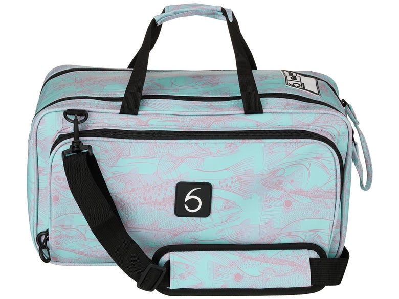 The 6th Sense Travel Bait Bag is shown sporting a turquoise base color overlaid with pink depictions of saltwater gamefish