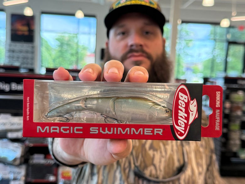 TW team member Rob holding up a Magic Swimmer while standing in the Georgia retail outlet location.