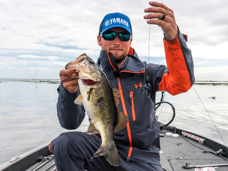 Justin Lucas holding a flip bass