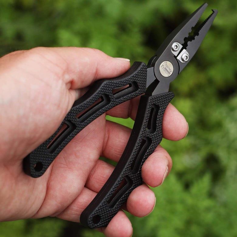 image of angler holding pliers