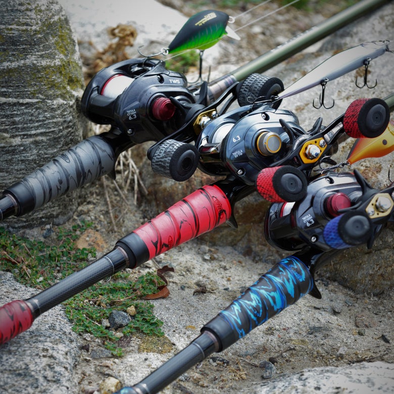 Three baitcasting rods with custom-wrapped split grip handles
