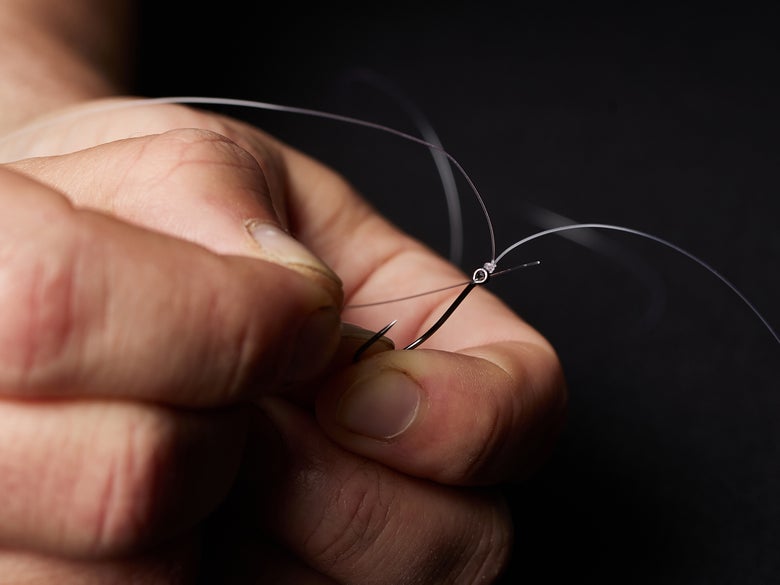 Threading the tag line through the eyelet
