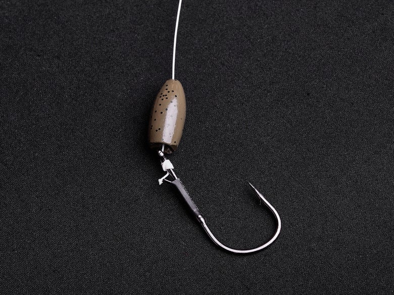 Completed snell knot on a straight-shank hook with a large weight on the line above.