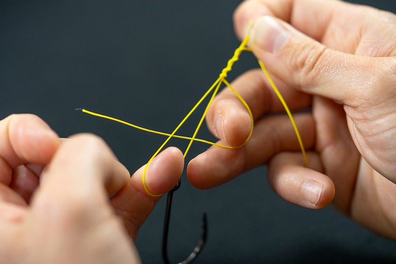 Pass Tag End through Base of Knot