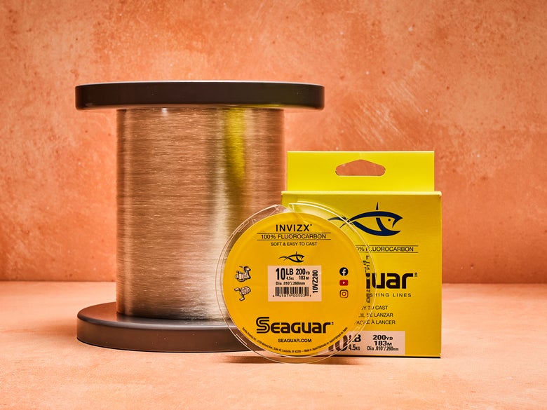 Image of a filler spool of seaguar invizx fluorocarbon next to a bulk spool of seaguar invizx