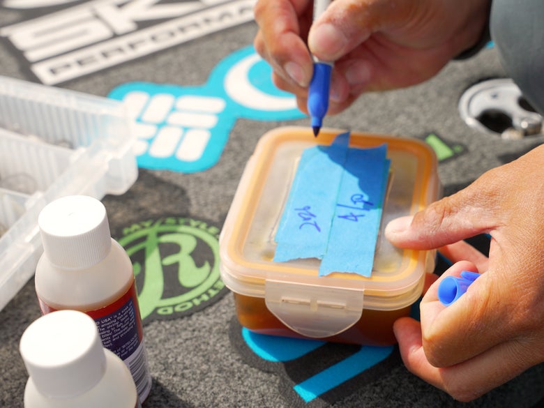 Image of blue painter's tape on the water tight container