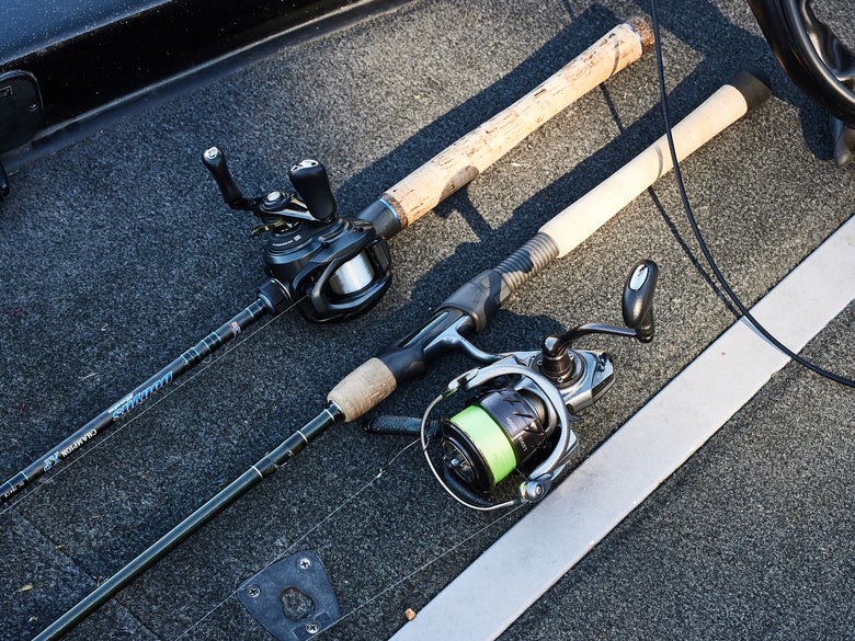Casting and spinning setups side by side on the front deck of a bass boat