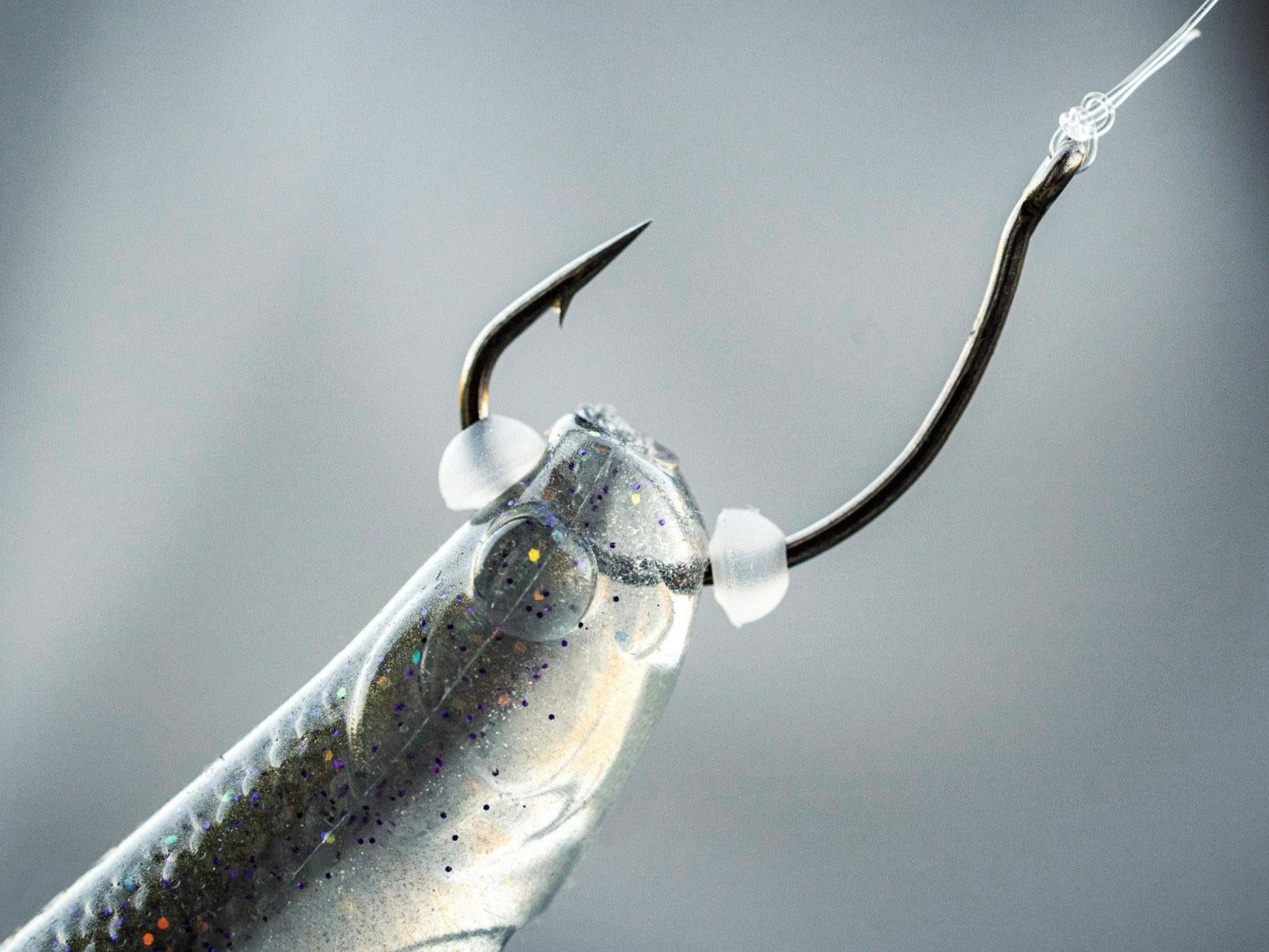 Closeup of the 6th Sense Rig Dots Soft Bait Keepers rigged on a hook with a soft jerkbait