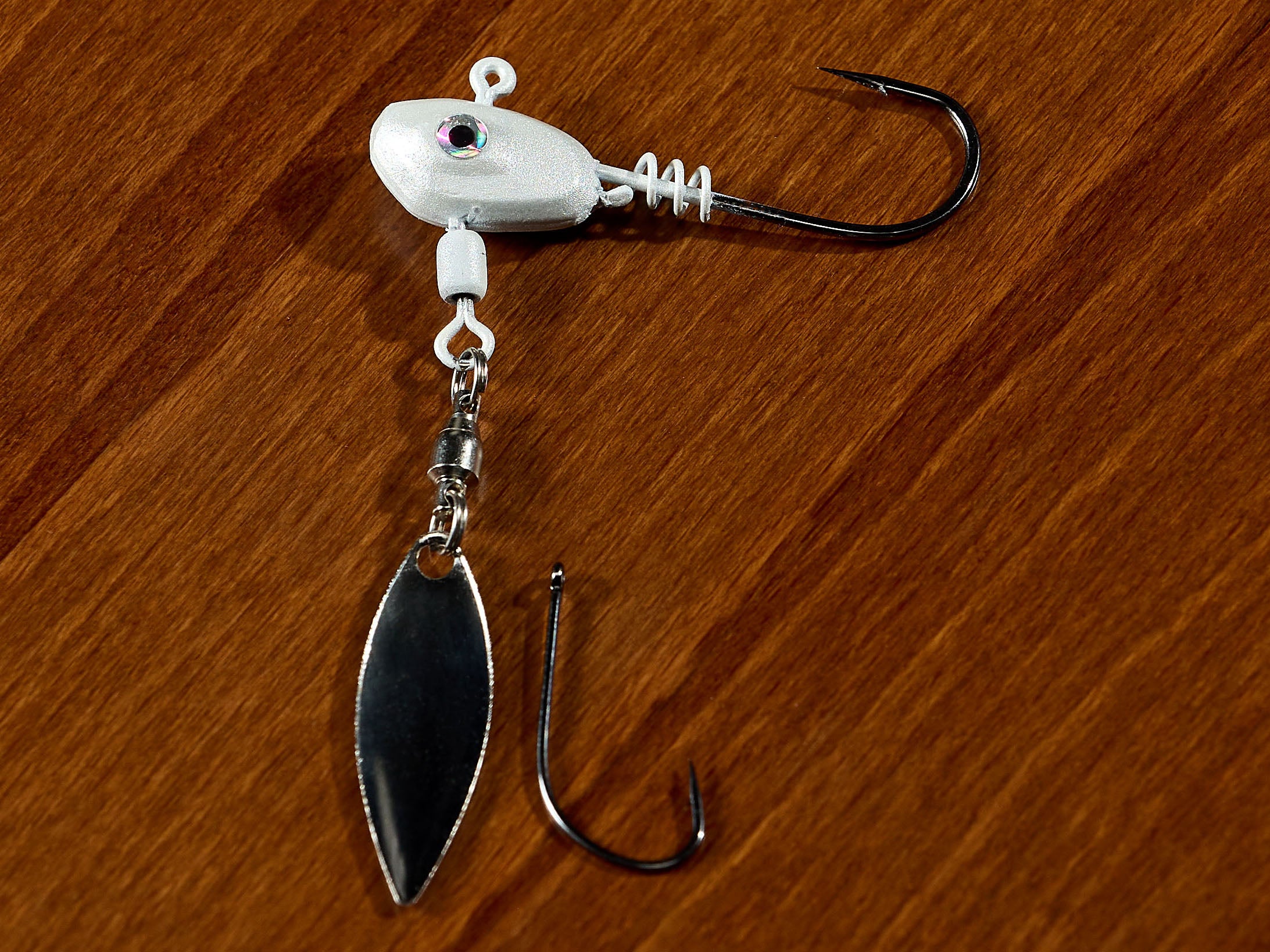 hook laying on table next to underspin blade