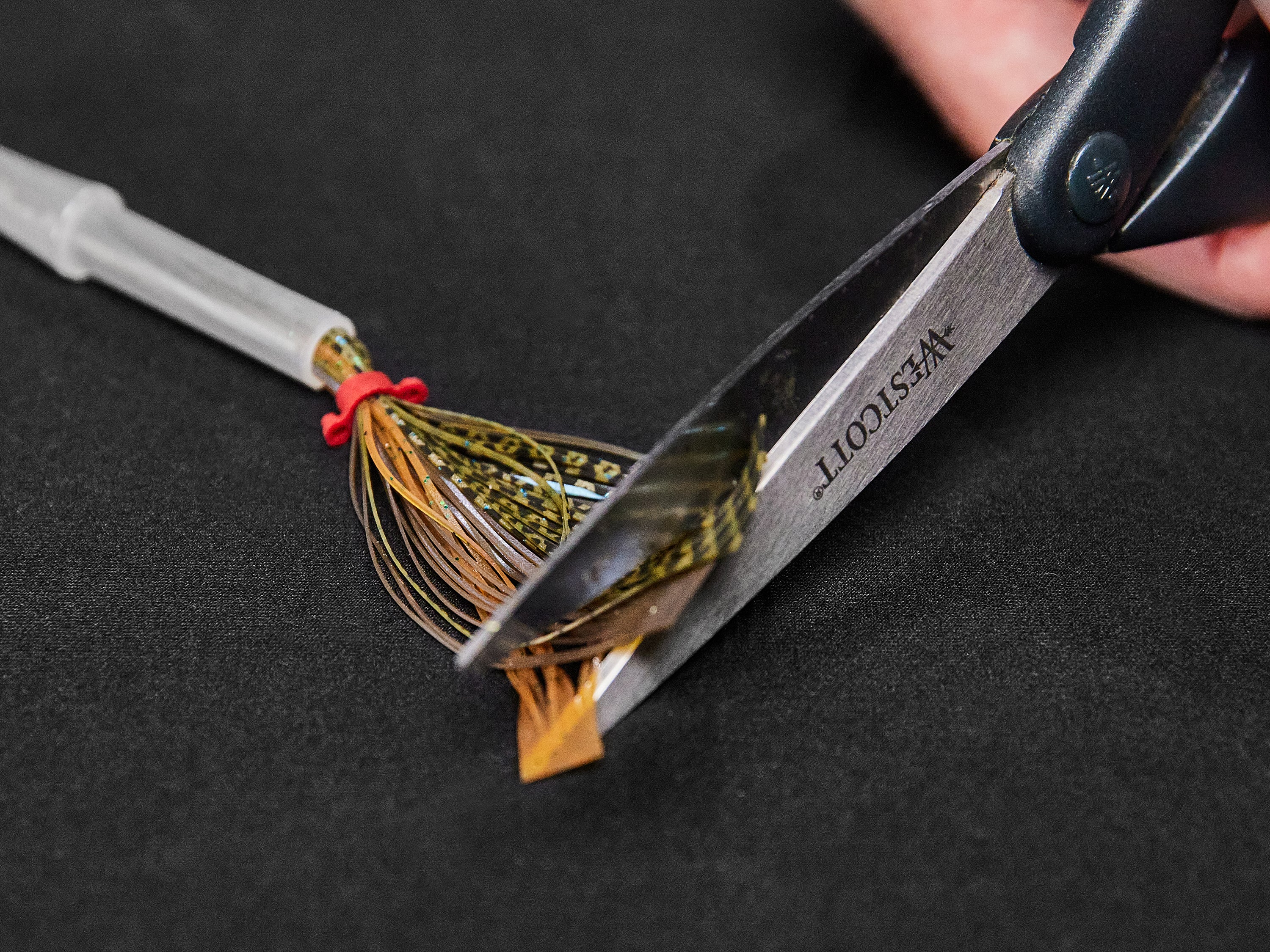 trimming tabs of newly made jig skirt