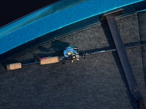 Dobyns rod on boat deck with reel and lure attached